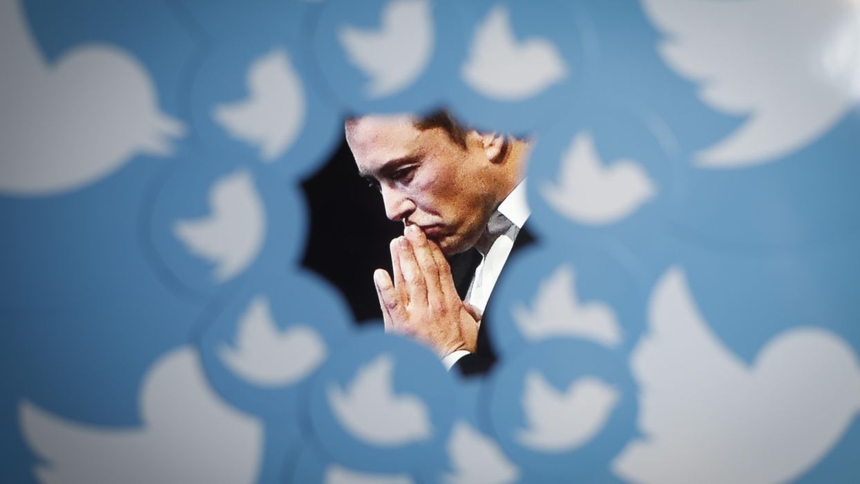 An image of new Twitter owner Elon Musk is seen surrounded by Twitter logos in this photo illustration