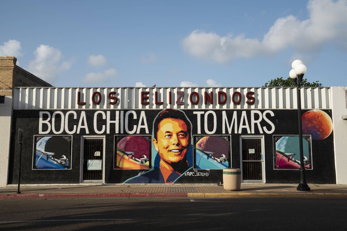 Painted storefront that says "Boca Chica to Mars" with Elon Musk's face 